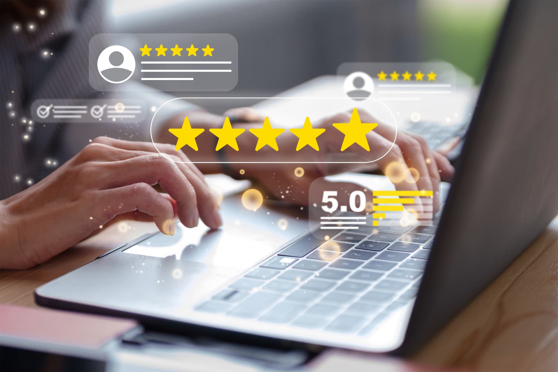 Hands typing on a laptop with floating review cards and a five-star rating